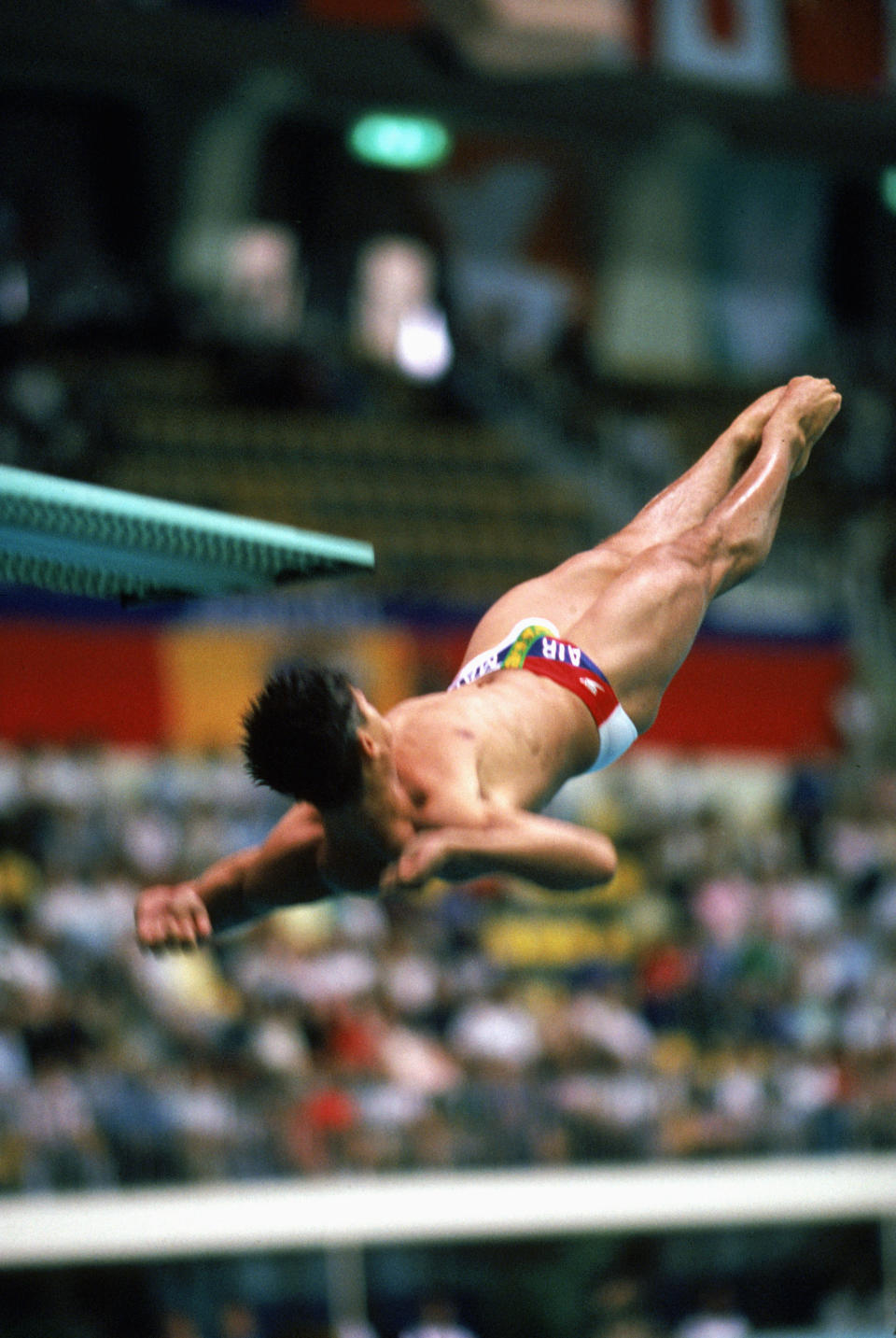 American diver Greg Louganis suffered a concussion after hitting his head on the springboard during the preliminary rounds while performing a reverse 2½ pike of the 3 metre springboard event at the 1988 Seoul Olympic Games. He completed the preliminaries despite his injury, earning the highest single score of the qualifying for his next dive, and went on to repeat the dive during the finals, earning the gold medal by a margin of 25 points. Louganis also won the gold medal in the 10 metre platform event at Seoul.