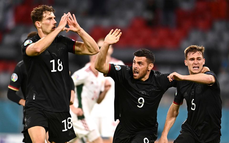 Germany's Leon Goretzka, left, celebrates with teammates after scoring his side's second goal  - AP