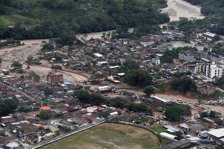 An aerial view shows a flooded area after heavy rains caused several rivers to overflow, pushing sediment and rocks into buildings and roads in Mocoa, Colombia April 1, 2017. Cesar Carrion/Colombian Presidency/Handout via Reuters