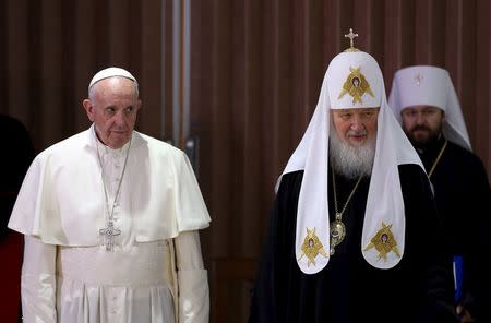 Pope Francis (L) and Russian Orthodox Patriarch Kirill stand together after a meeting in Havana, February 12, 2016. REUTERS/Alejandro Ernesto/Pool