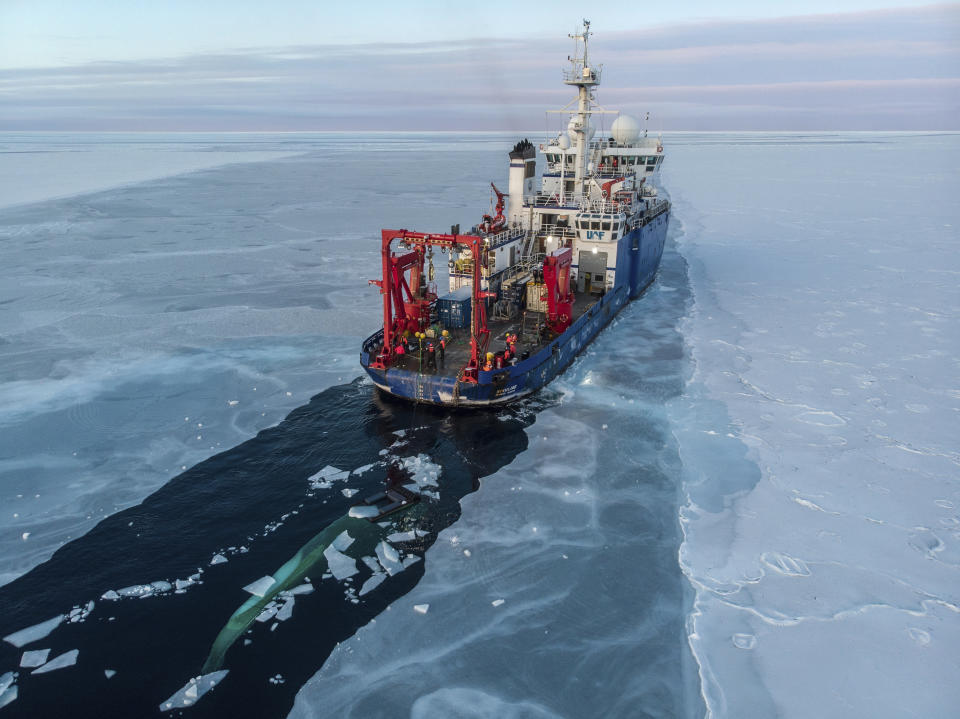 In this Nov. 14, 2019, photo provided by John Guillote and taken from an aerial drone shows the U.S. research vessel Sikuliaq as it makes its way through sea ice in the Beaufort Sea off Alaska's north coast. University of Washington scientists onboard the research vessel are studying the changes and how less sea ice will affect coastlines, which already are vulnerable to erosion because increased waves delivered by storms. More erosion would increase the chance of winter flooding in villages and danger to hunters in small boats. (John Guillote via AP)