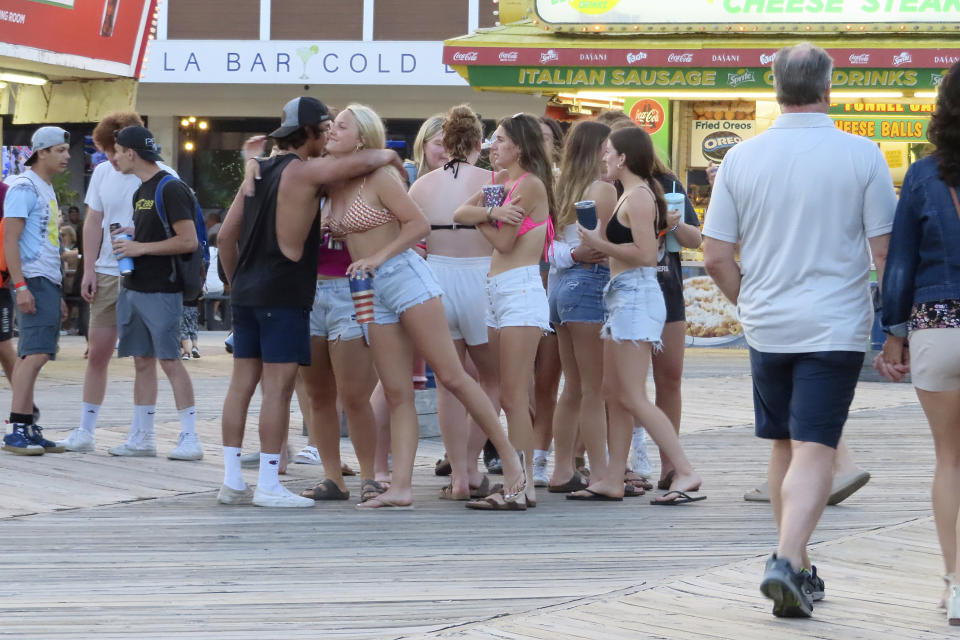 Crowds of people gather on the Seaside Heights N.J. boardwalk on June 2, 2023. On Feb. 23, 2024, New Jersey selected 18 Jersey Shore towns to split $100 million in funds to repair or rebuild their boardwalks. (AP Photo/Wayne Parry)