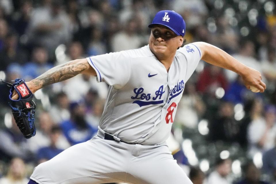 Dodgers relief pitcher Victor Gonzalez throws during the sixth inning against the Milwaukee Brewers.