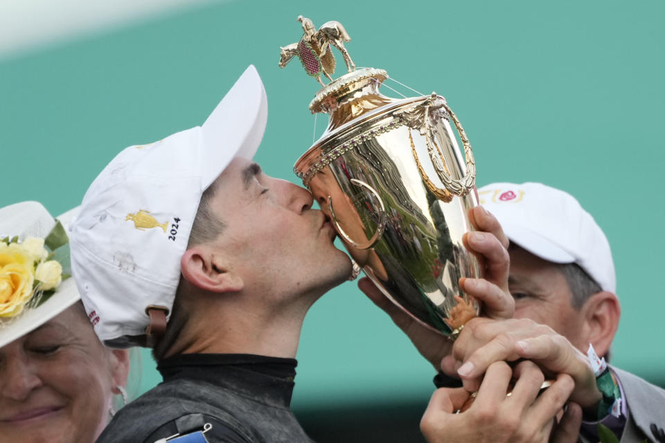 Brian Hernandez Jr. celebrates in the winner's circle after riding Mystik Dan to win the 150th running of the Kentucky Derby horse race at Churchill Downs Saturday, May 4, 2024, in Louisville, Ky. (AP Photo/Jeff Roberson)