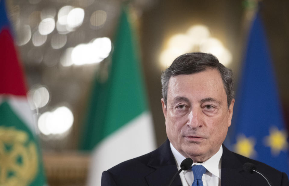 Former European Central Bank president Mario Draghi speaks to the media after accepting a mandate to form Italy's new government from Italian President Sergio Mattarella at the Rome's Quirinale Presidential Palace, Wednesday Feb. 3, 2021. (AP Photo/Alessandra Tarantino, Pool)