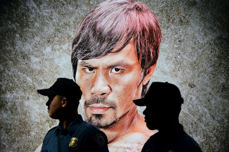 Policemen stand in front of Philippine boxing icon Manny Pacquiao's portrait in Manila on May 13, 2015