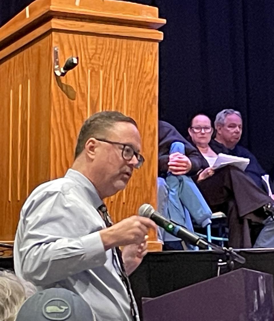 Steve Strojny of Monument Beach, sponsor of the marijuana sales ban repeal, spoke several times at Monday’s special town meeting in Bourne. The ban was lifted on a 453 to 359 vote by a record crowd.