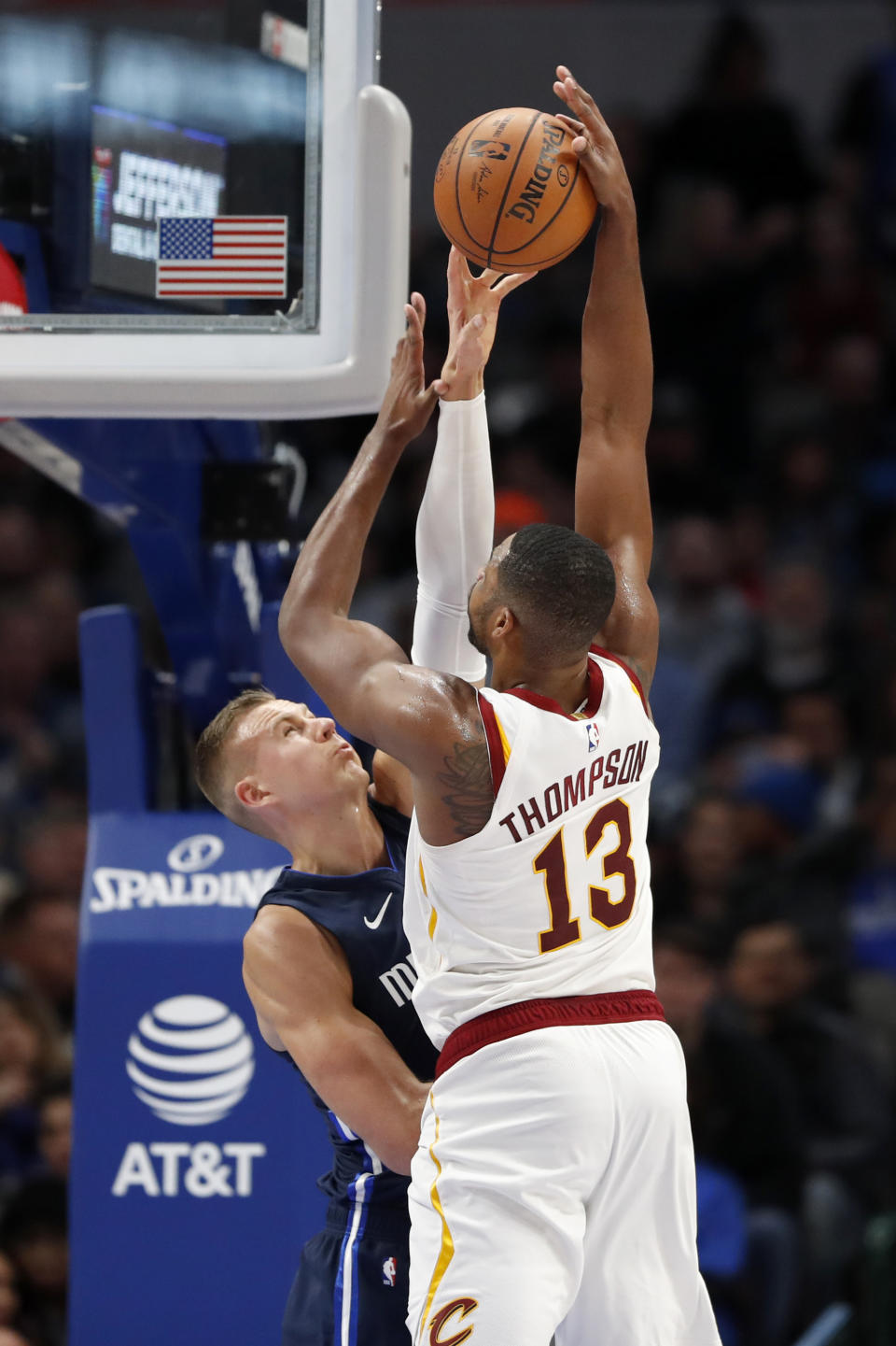 Dallas Mavericks forward Kristaps Porzingis (6) blocks a shot attempt by Cleveland Cavaliers center Tristan Thompson (13) in the first half of an NBA basketball game in Dallas, Friday, Nov. 22, 2019. (AP Photo/Tony Gutierrez)