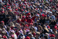 Supporters of President Donald Trump listen to him speak during a campaign rally at Laughlin/Bullhead International Airport, Wednesday, Oct. 28, 2020, in Bullhead City, Ariz. (AP Photo/Evan Vucci)