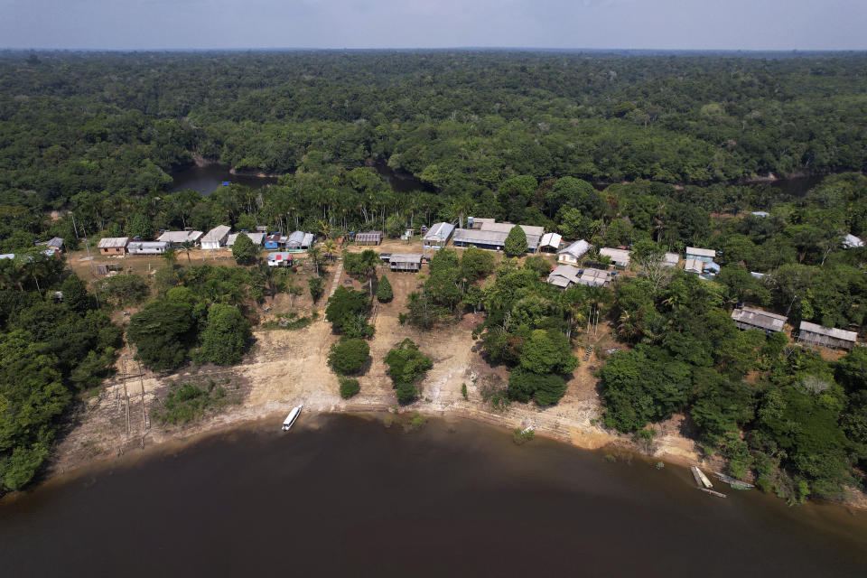 An aerial view of the Bela Vista do Jaraqui community where electoral workers arrived with electronic voting machines to be delivered to polling stations, a day ahead of the country's elections, in Manaus, Amazonas state, Brazil, Saturday, Oct. 1, 2022. (AP Photo/Edmar Barros)