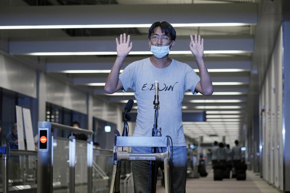 Japanese freelance journalist Yuki Kitazumi speaks upon arrival at Narita international airport after returning home from a Myanmar prison, in Narita, east of Tokyo, on May 14, 2021. Kitazumi said Friday, May 21, 2021 during an online press conference that military and police interrogators repeatedly asked him about his friends, clients and fake allegations. And he heard from other inmates about their horrifying prison abuses, including repeated beatings during nonstop, dayslong interrogations. (AP Photo/Eugene Hoshiko)