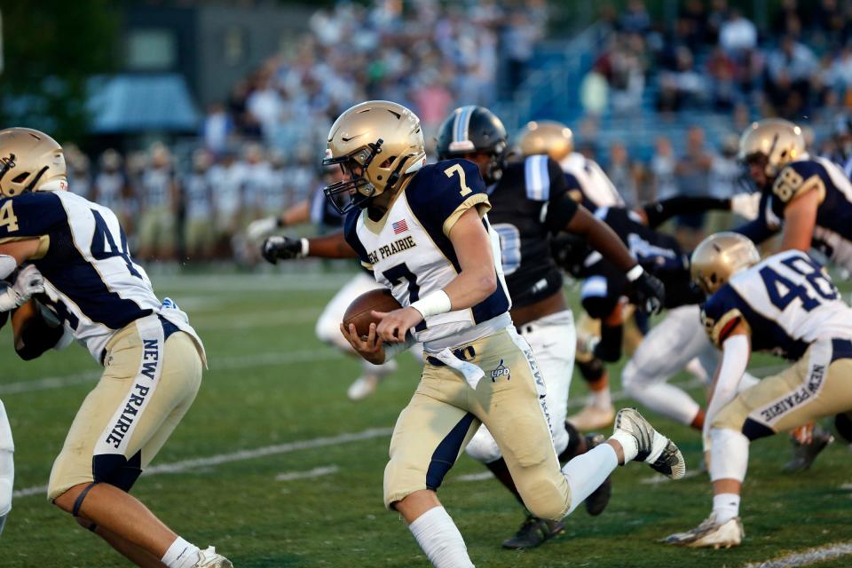 New Prairie senior quarterback Marshall Kmiecik (7) runs with the ball during a game against South Bend Saint Joseph Friday, Sept. 15, 2023, at Father Bly Field in South Bend.