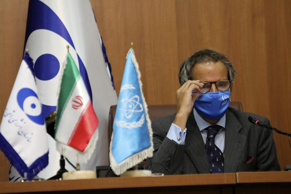 Director General of International Atomic Energy Agency, IAEA, Rafael Mariano Grossi adjust his glasses at a press briefing with the head of the Atomic Energy Organization of Iran, Ali Akbar Salehi, in Tehran, Iran, Tuesday, Aug. 25, 2020. (Atomic Energy Organization of Iran via AP)