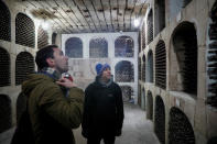 Participants tour a wine cellar after the "Milestii Mici Wine Run 2019" race, at a distance of 10 km in the world's largest wine cellars in Milestii Mici, Moldova January 20, 2019. Picture taken January 20, 2019. REUTERS/Gleb Garanich