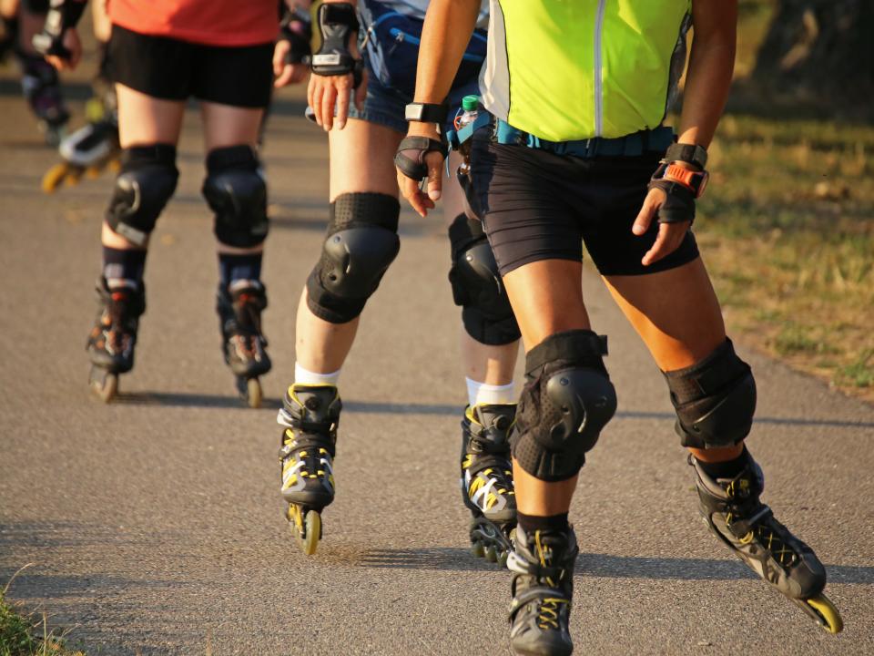 People wearing rollerblades.