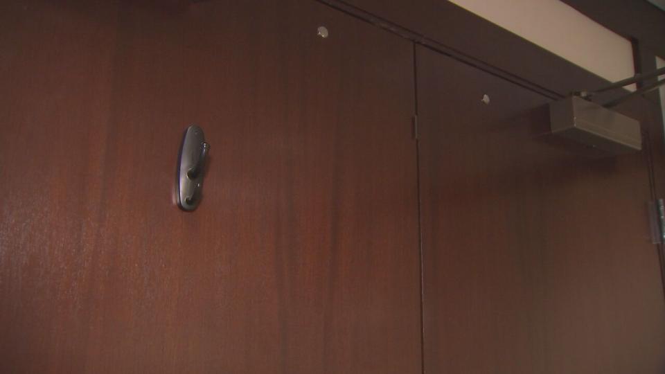 A wall hanger affixed to the conference room door is also hiding a small camera.