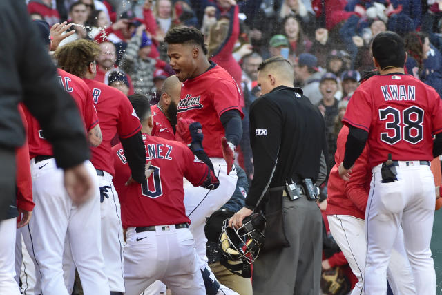 Cleveland Guardians right fielder Oscar Gonzalez celebrates his walk-off  home run in the 15th inning to beat the Tampa Bay Rays 1-0. The…