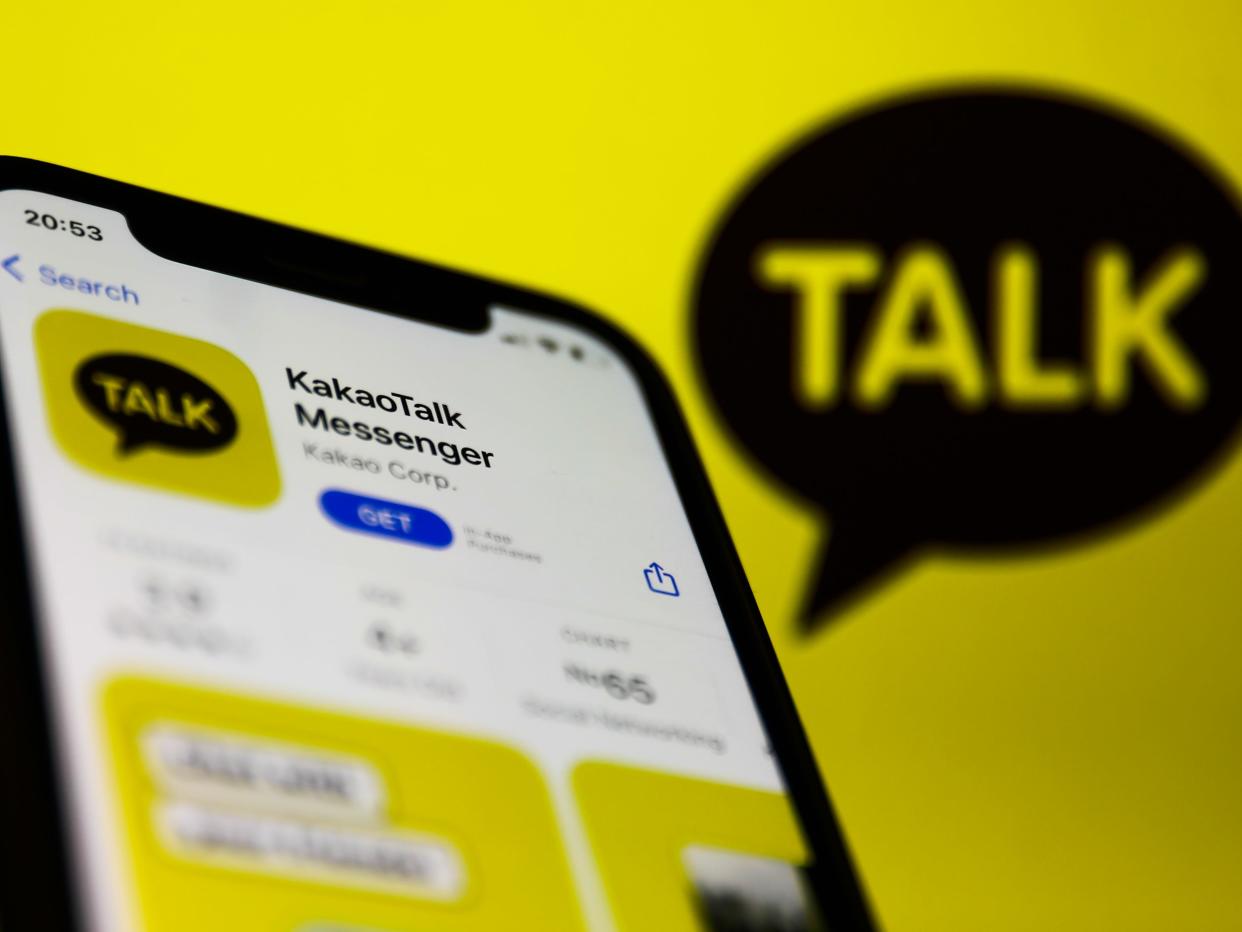 KakaoTalk logo on the App Store and KakaoTalk logo displayed on a screen in the background are seen in this illustration photo