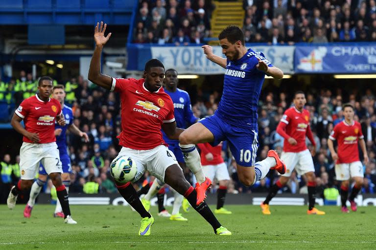 Chelsea's Eden Hazard (3R) tries to get past Manchester United's Tyler Blackett during their English Premier League match at Stamford Bridge on April 18, 2015