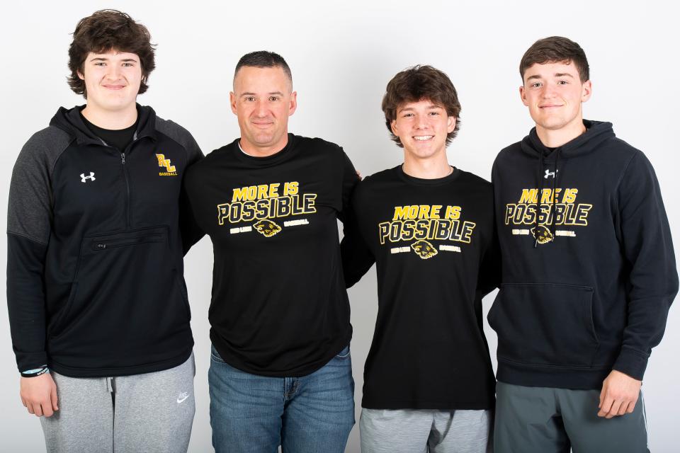 Red Lion baseball head coach Kevin Lawrence poses for a photo with players AJ Lipscomb, Jaden Taylor and Connor Lawrence during YAIAA spring sports media day on March 3, 2024, in York.