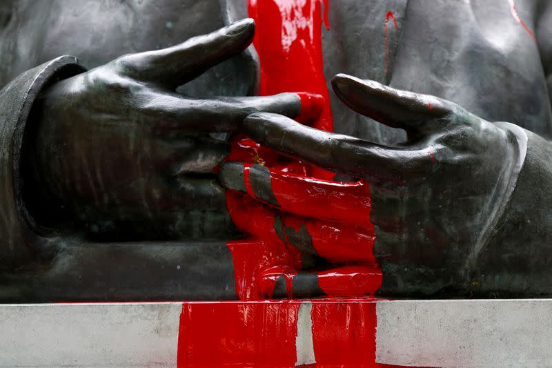 Statue of former Belgian King Baudouin is seen covered in red paint in Brussels