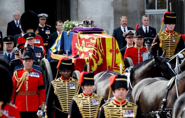 The Queen's coffin carried on a horse-drawn gun carriage of the King’s Troop Royal Horse Artillery during the ceremonial procession from Buckingham Palace to Westminster Hall on Wednesday 