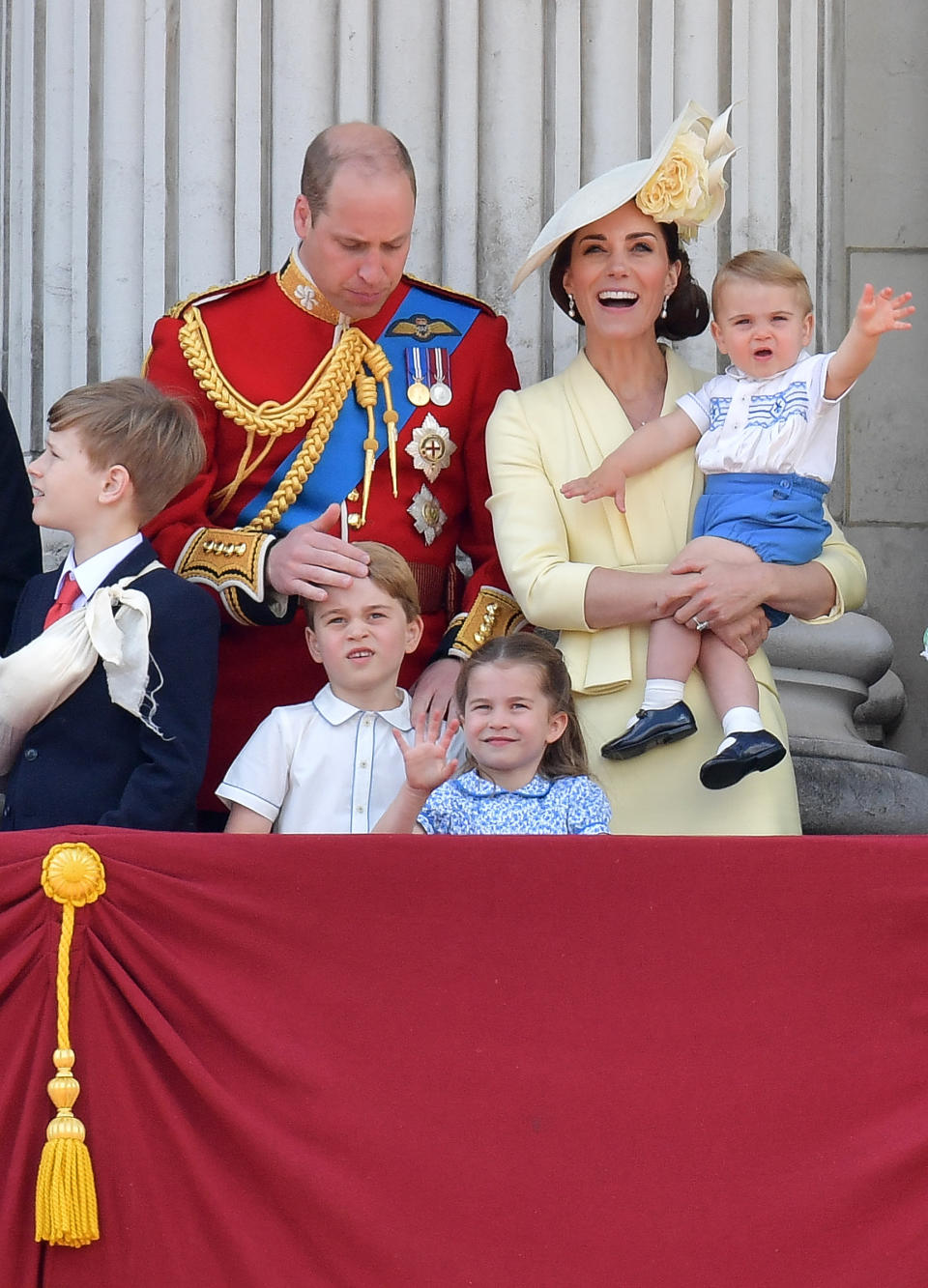 (L-R) Britain's Prince William, Duke of Cambridge, Prince George, Princess Charlotte and Britain's Catherine, Duchess of Cambridge holding Prince Louis stand with other members of the Royal Family on the balcony of Buckingham Palace to watch a fly-past of aircraft by the Royal Air Force, in London on June 8, 2019. - The ceremony of Trooping the Colour is believed to have first been performed during the reign of King Charles II. Since 1748, the Trooping of the Colour has marked the official birthday of the British Sovereign. Over 1400 parading soldiers, almost 300 horses and 400 musicians take part in the event. (Photo by Daniel LEAL-OLIVAS / AFP)        (Photo credit should read DANIEL LEAL-OLIVAS/AFP/Getty Images)