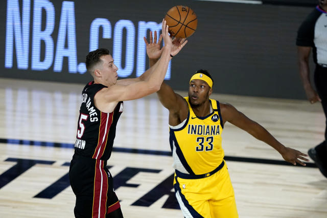 Miami Heat's Duncan Robinson shoots as Indiana Pacers' Myles Turner (33) defends during the first half of an NBA basketball first round playoff game, Monday, Aug. 3, 2020, in Lake Buena Vista, Fla. (AP Photo/Ashley Landis, Pool)