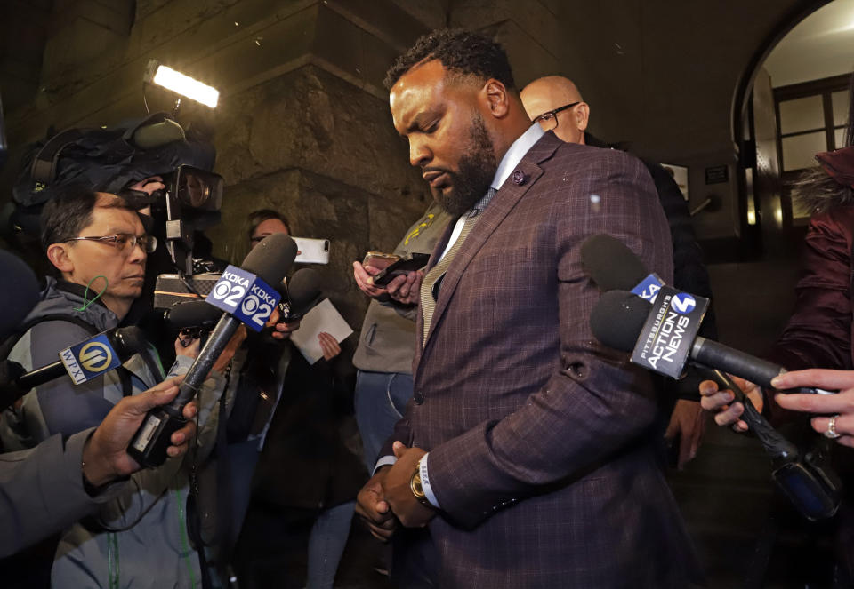 S. Lee Merritt, attorney for Michelle Kenney, the mother of Antwon Rose II, talks with reporters as he leaves the Allegheny County Courthouse after hearing the verdict of not guilty on all charges for Michael Rosfeld, a former police officer in East Pittsburgh, Pa., Friday, March 22, 2019. Rosfeld was charged with homicide in the fatal shooting of Antwon Rose II as he fled during a traffic stop on June 19, 2018. (AP Photo/Gene J. Puskar)