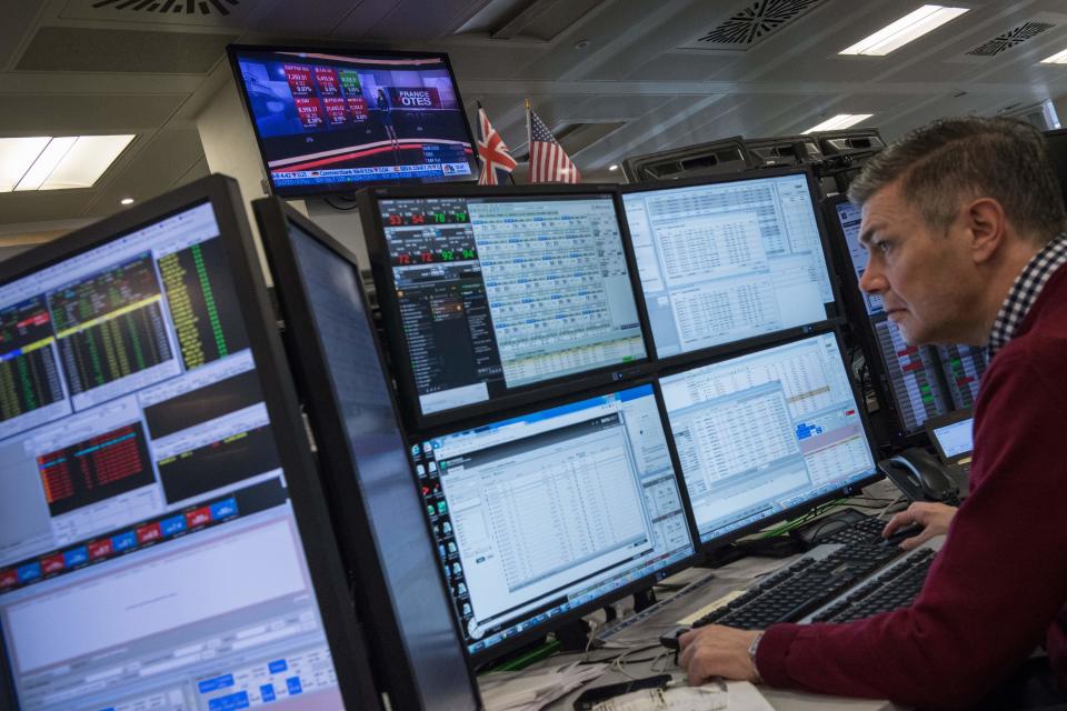 A television screen displays news footage relating to the result of France's presidential election, as traders works on the trading floor of ETX Capital in London on May 8, 2017. The Paris stock market rose slightly at the open Monday after the expected French presidential election win for Emmanuel Macron. Macron won a resounding victory in the French presidential election but the focus will shift immediately Monday to whether he can govern the country without the support of a traditional party. / AFP PHOTO / CHRIS J RATCLIFFE        (Photo credit should read CHRIS J RATCLIFFE/AFP via Getty Images)