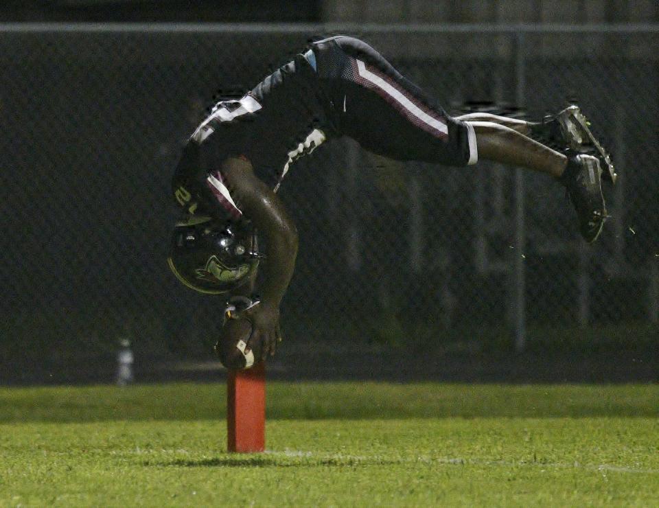 Palm Beach Central receiver Markel King flips into the end zone to celebrate his second touchdown of the night. His two scores helped to highlight a 44-14 offensive blowout over visiting Dwyer on Sept. 3, 2021.