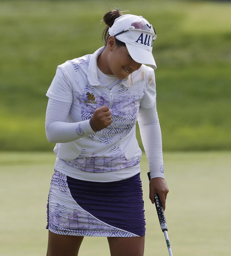 Jasmine Suwannapura, of Thailand, reacts after her birdie putt on the 18th green during the third round of the Dow Great Lakes Bay Invitational golf tournament, Friday, July 19, 2019, in Midland, Mich. (AP Photo/Carlos Osorio)