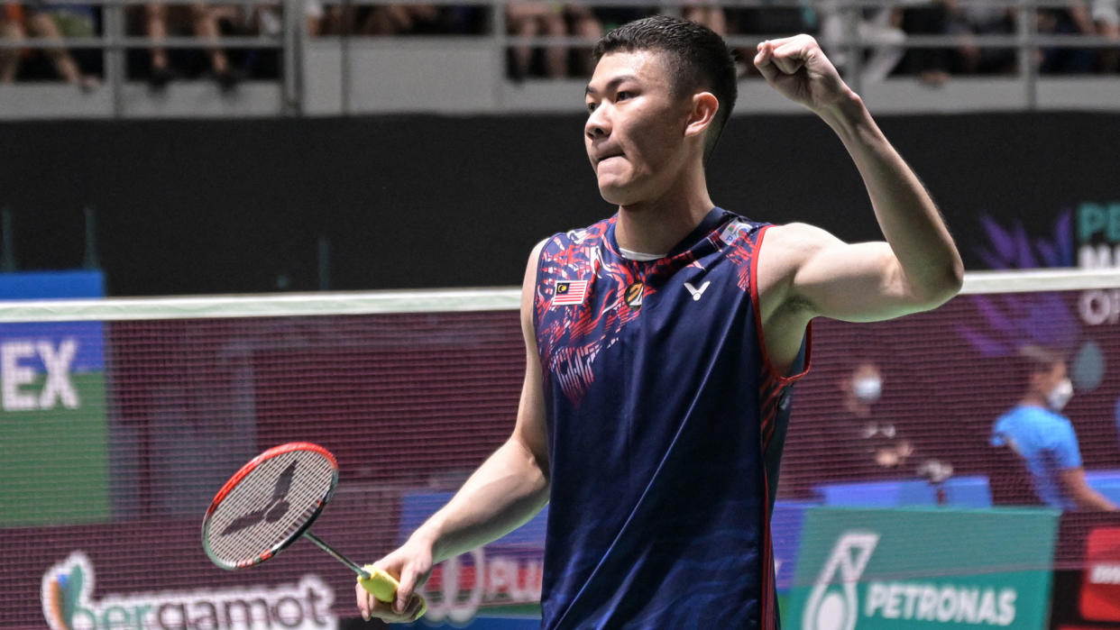 Malaysia's Lee Zii Jia holds his left fist in the air. (PHOTO: Mohd Rasfan/AFP via Getty Images)