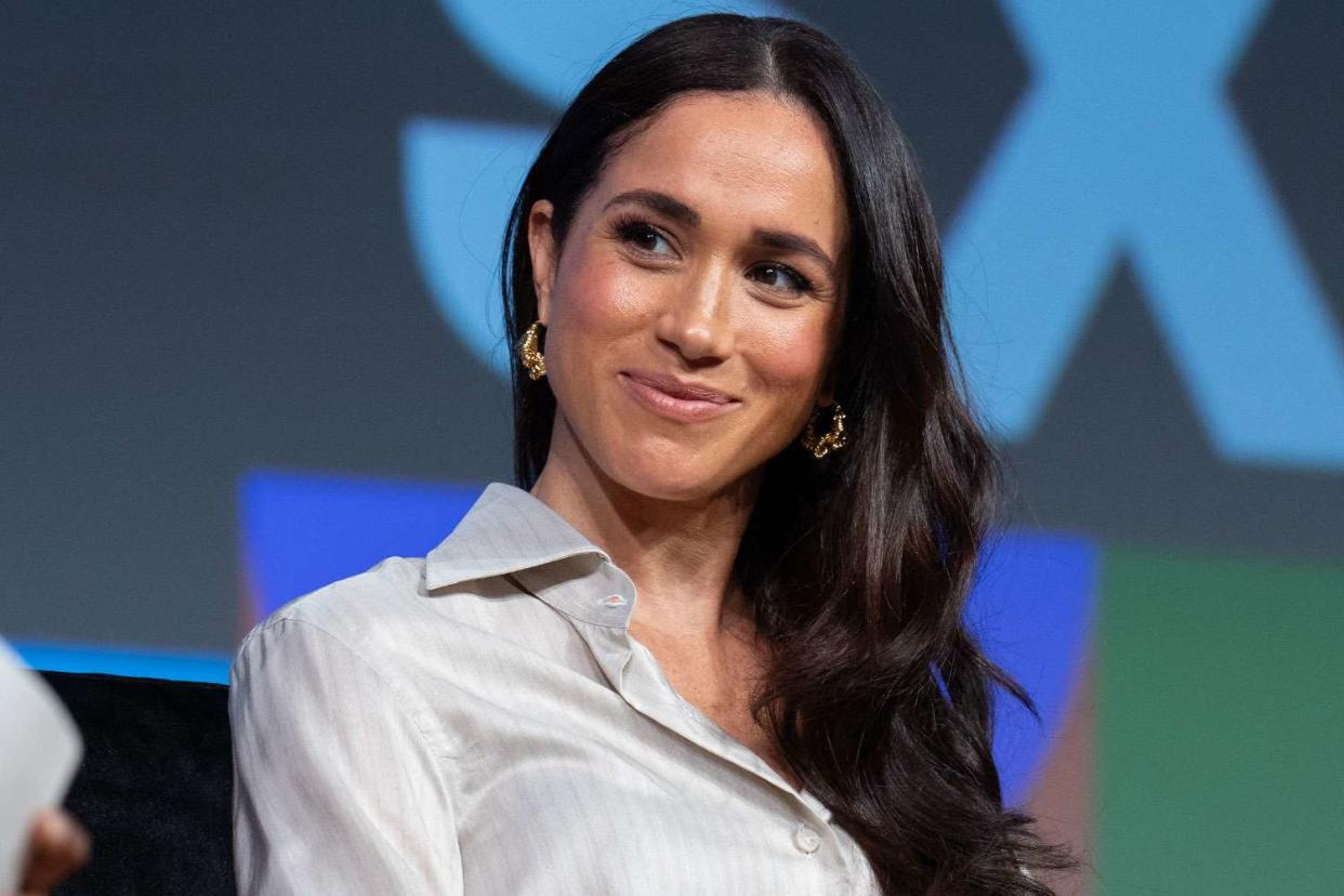 <p>SUZANNE CORDEIRO/AFP via Getty </p> Meghan Markle in March 2024