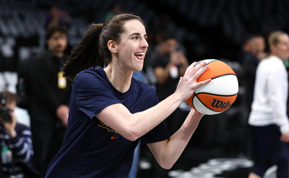 Indiana Fever guard Caitlin Clark warms up before an WNBA basketball game against the New York Liberty, Saturday, May 18, 2024, in New York. (AP Photo/Noah K. Murray)