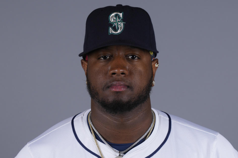 FILE - This is a 2024 photo of pitcher Gregory Santos of the Seattle Mariners baseball team. Santos threw a light bullpen session Friday, March 8, 2024, his first since experiencing right lat soreness after throwing off a mound at the the start of spring training three weeks ago. (AP Photo/Lindsey Wasson)