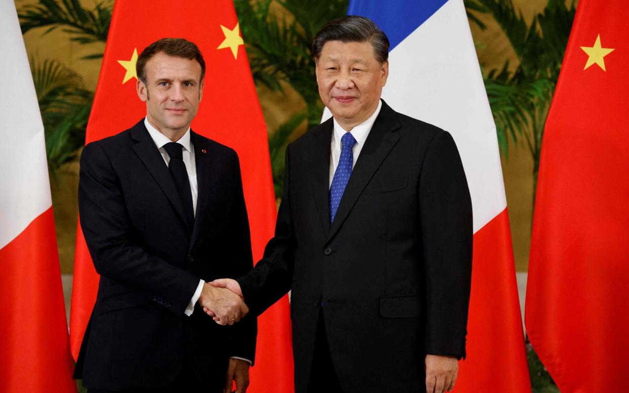 Emmanual Macron and Xi Jinping are due to meet for talks on Tuesday - LUDOVIC MARIN/AFP