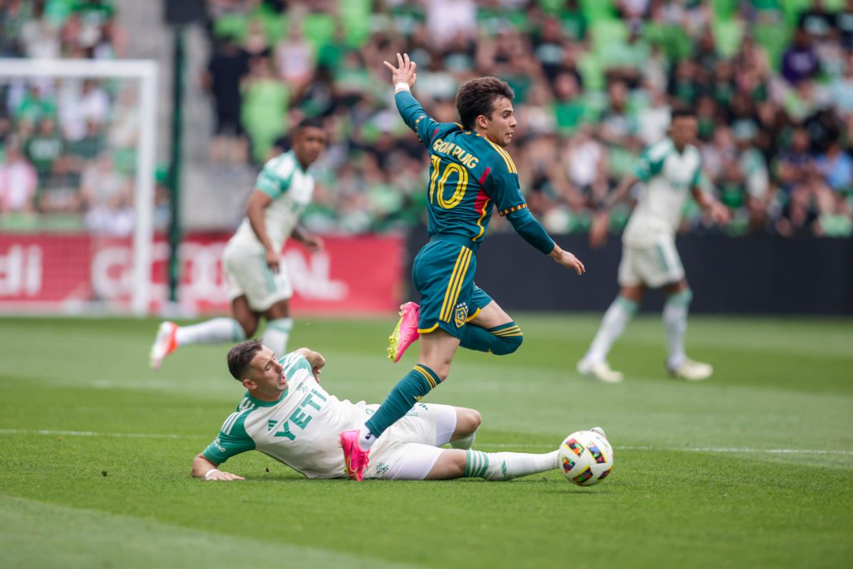 Galaxy midfielder Ricard Puig avoids a sliding tackle, but he and his teammates couldn't score against the stout Austin FC defense.