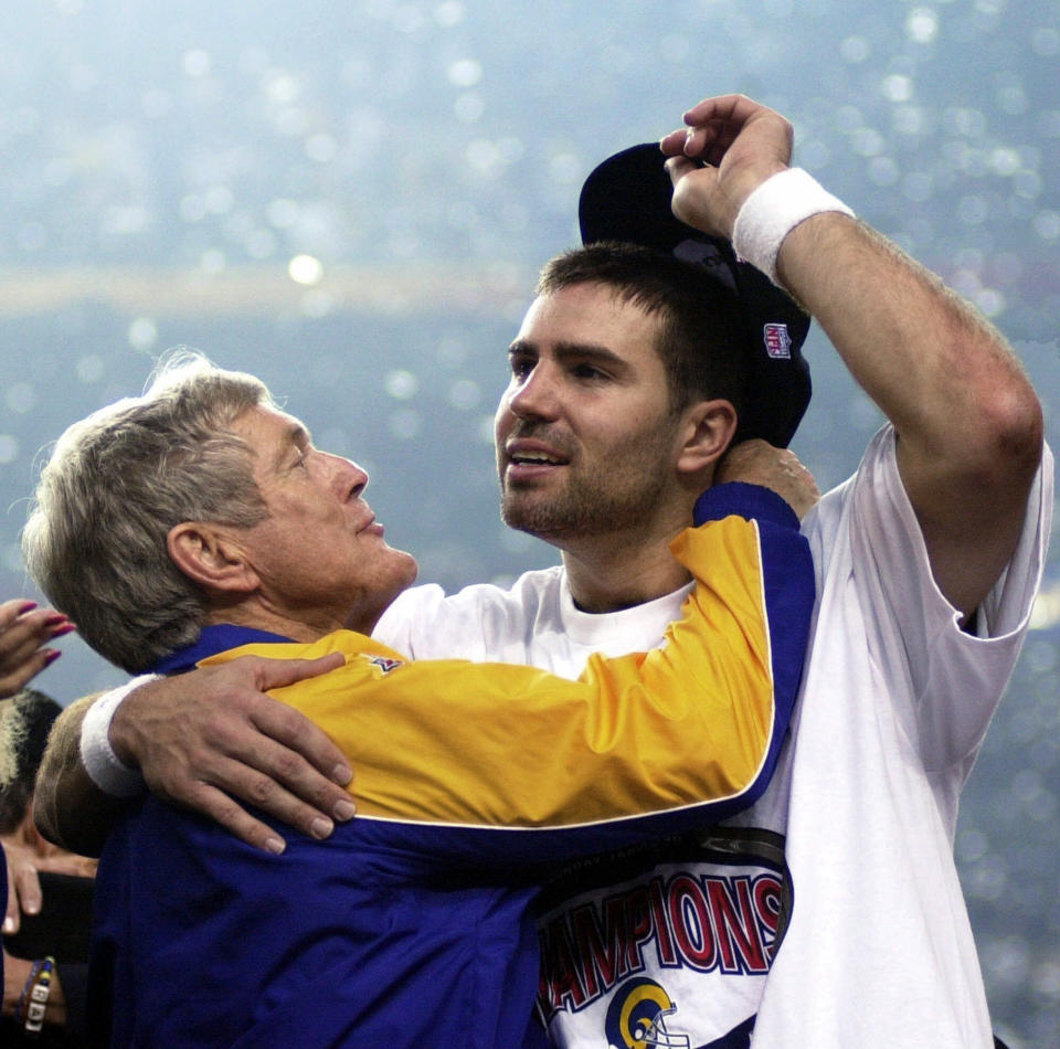 FILE - St. Louis Rams quarterback Kurt Warner, right, gets a hug from coach Dick Vermeil after the Rams defeated the Tennessee Titans 23-16 to win NFL football's Super Bowl 34 in Atlanta. Vermeil won a Super Bowl with the St. Louis Rams and later coached the Kansas City Chiefs. But Philly is home and he’s going into the Pro Football Hall of Fame as an Eagle. (AP Photo/Dave Martin, File)