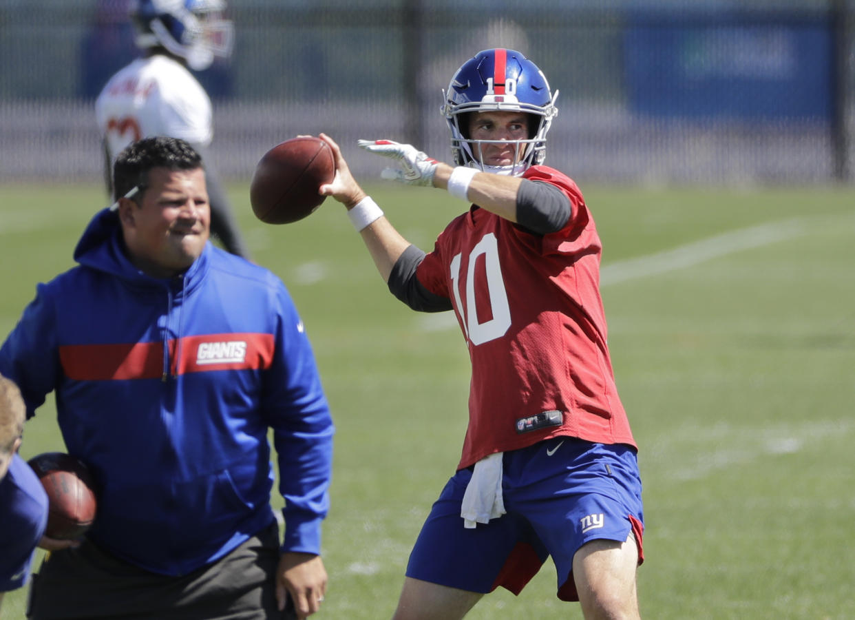 New York Giants' Eli Manning throws a pass during an NFL football minicamp at the team's training facility Tuesday, June 4, 2019, in East Rutherford, N.J. (AP Photo/Frank Franklin II)