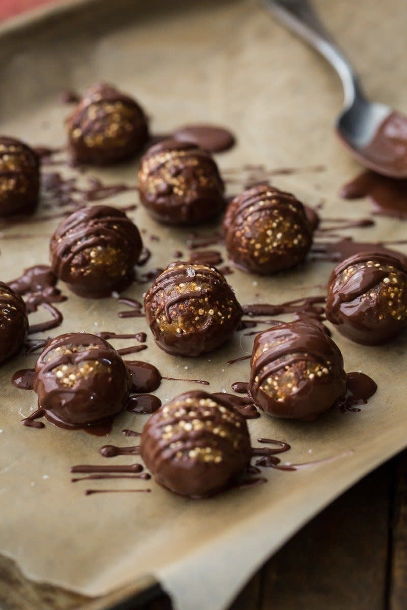 <strong>Get the <a href="https://naturallyella.com/peanut-butter-buckeye-balls-with-popped-quinoa/" target="_blank">Peanut Butter Buckeye Balls with Popped Quinoa recipe</a>&nbsp;from Naturally Ella</strong>