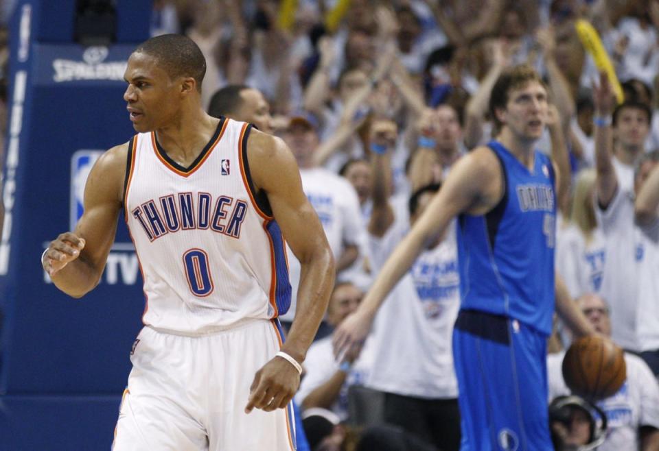 Russell Westbrook pumps his first during a first-round sweep of Dirk Nowitzki's Mavericks in 2012. (AP)