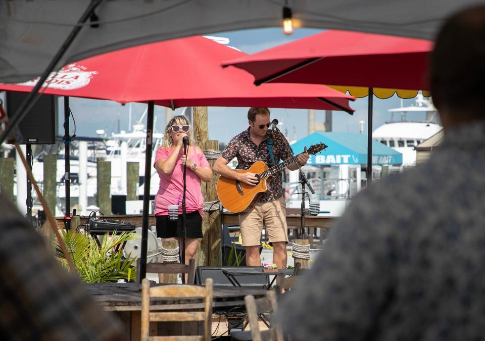 Musicians Liz and Brady Smith, who perform as Briz and Lady, play at The RUDE Shrimp Company on Tuesday, Sept. 12, 2023 at Moss Marina on Fort Myers Beach.
