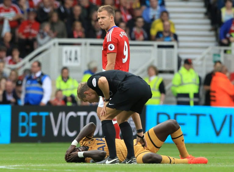 Tottenham Hotspur's French midfielder Moussa Sissoko lays onthe pitch injured during the English Premier League football match between Middlesbrough and Tottenham Hotspur at Riverside Stadium on September 24, 2016