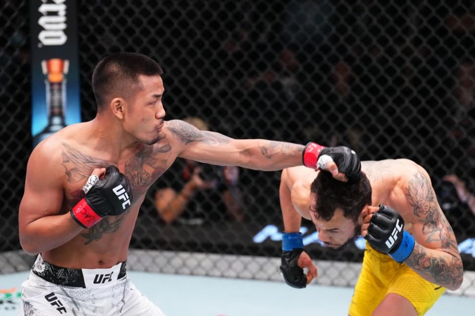 LAS VEGAS, NEVADA – JANUARY 13: (L-R) Joshua Van of Myanmar punches Felipe Bunes of Brazil in a flyweight fight during the UFC Fight Night event at UFC APEX on January 13, 2024 in Las Vegas, Nevada. (Photo by Chris Unger/Zuffa LLC via Getty Images)