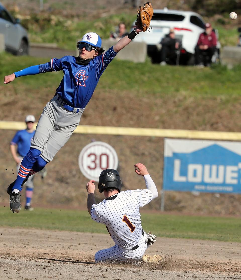 South Kitsap's Ty Orser (1) is safe at second as the throw to Graham-Kapowsin's Busby Low goes awry during South Kitsap's 8-1 win in Port Orchard, on Tuesday, April 4, 2023.