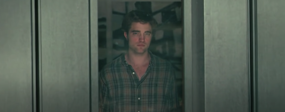 A man stares out of a window