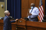 Dr. Anthony Fauci, director of the National Institute for Allergy and Infectious Diseases, left, talks with Committee chairman Rep. James Clyburn, D-S.C., as he arrives to testify before a House Subcommittee hearing on the Coronavirus crisis, Friday, July 31, 2020 on Capitol Hill in Washington. (Kevin Dietsch/Pool via AP)