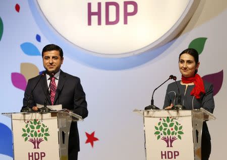 File Photo: Co-chairs of the pro-Kurdish Peoples' Democratic Party (HDP), Selahattin Demirtas and Figen Yuksekdag, attend a meeting to announce their party's manifesto for the upcoming general election, in Istanbul April 21, 2015. REUTERS/Murad Sezer/File Photo