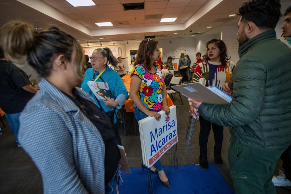 Edith Gonzalez, middle, along with a group of volunteers are heading out to help campaign for